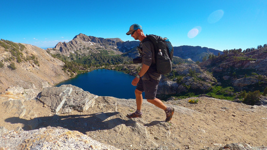 hiker walking the ruby mountains with liberty lake in the background